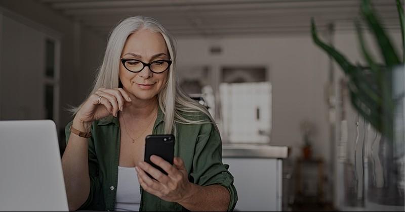 Woman on phone at computer