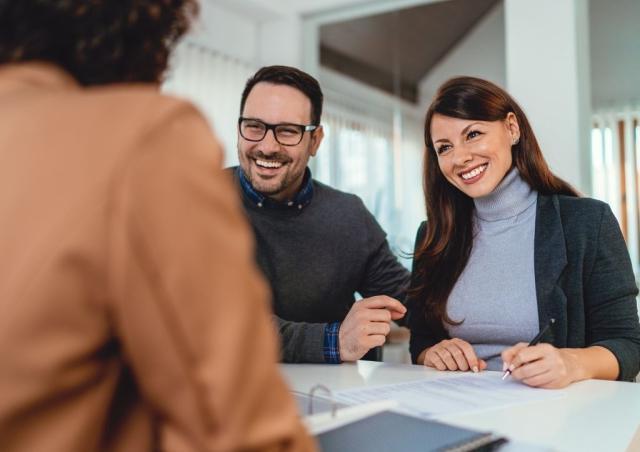 Couple joining a credit union or bank.